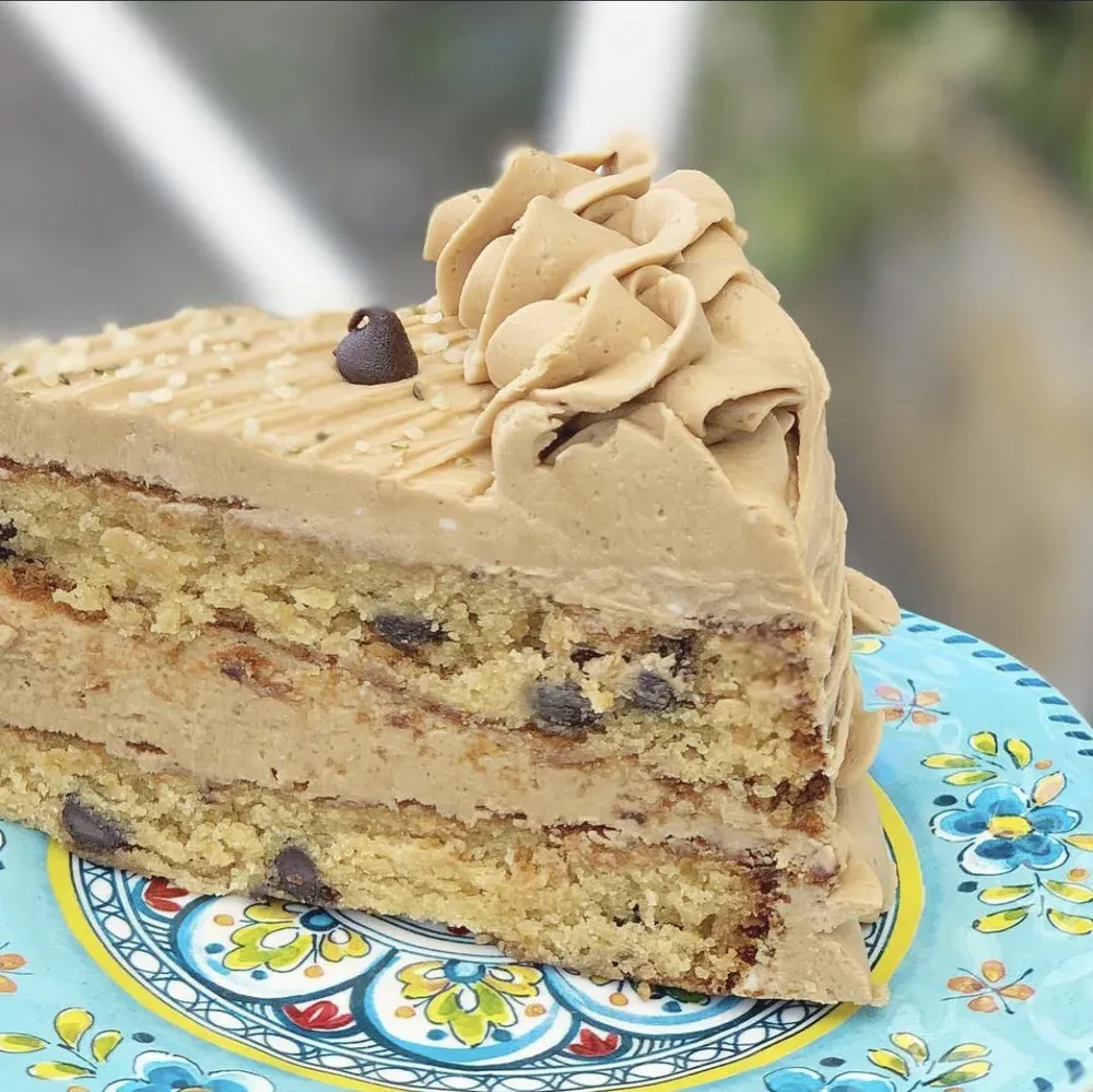 vegan coffee layer cake on a patterned plate