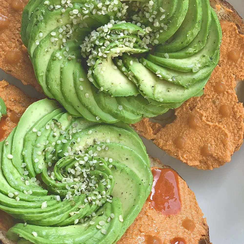 avocado roses with hemp seeds on toast