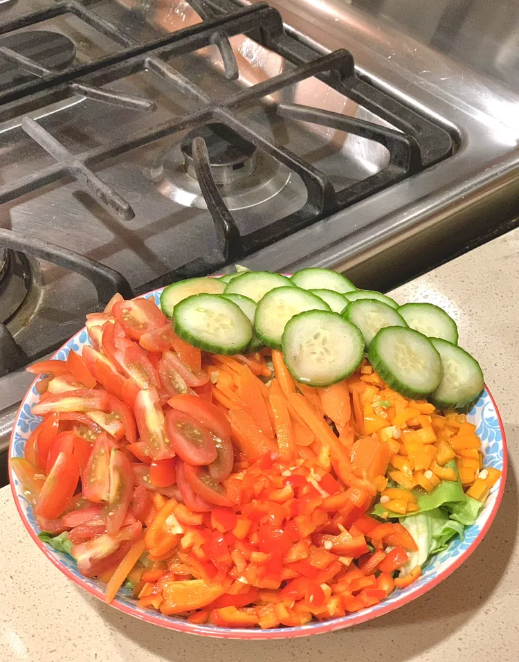 rainbow rice bowl with peppers and cucumber